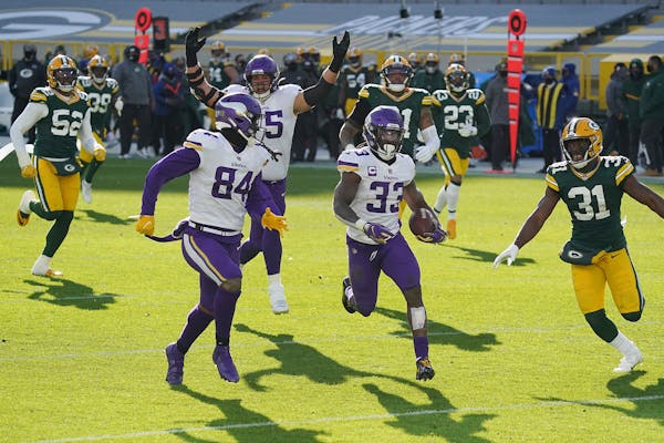 Minnesota Vikings running back Dalvin Cook (33) broke past the Green Bay Packers defense as he ran the ball in for a touchdown in the third quarter.