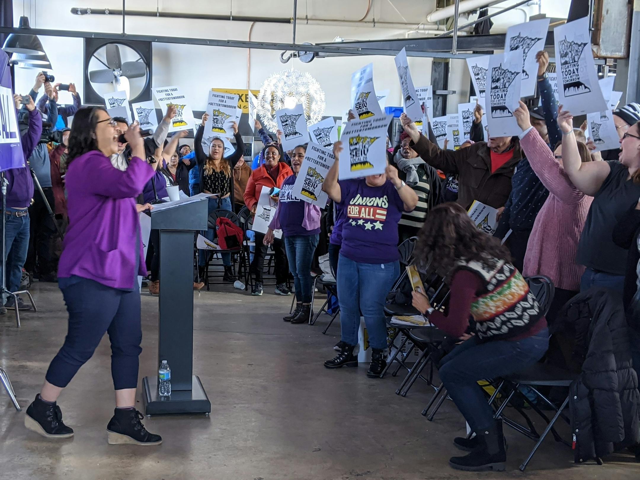 Iris Altamirano, president of SEIU Local 26, addressed hundreds of janitors and security officers at a packed union hall Saturday as they voted unanimously to authorize a strike over sick pay and wages.
