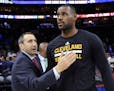 FILE - In this Nov. 2, 2015, file photo, Cleveland Cavaliers coach David Blatt pats LeBron James on the chest at the end of a game against the Philade