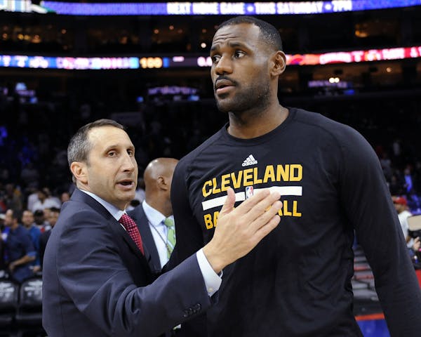 FILE - In this Nov. 2, 2015, file photo, Cleveland Cavaliers coach David Blatt pats LeBron James on the chest at the end of a game against the Philade