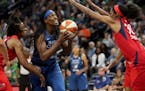 The Lynx's Sylvia Fowles drives on the Washington Mystics' Latoya Sanders during the first half of a game last August.