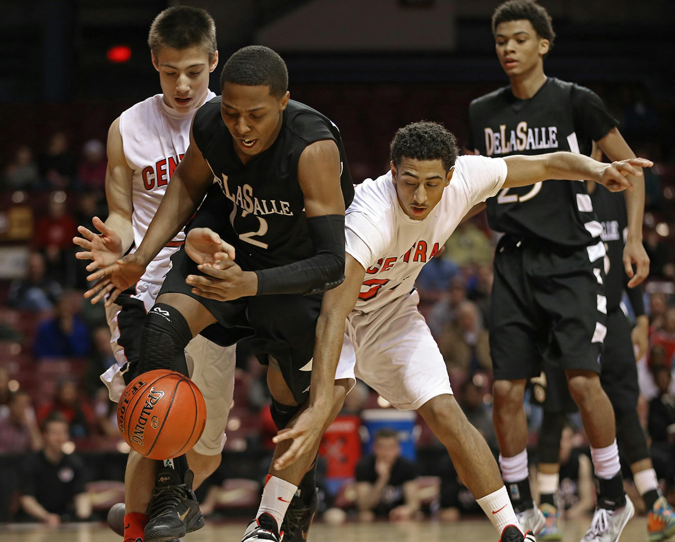 (left to right) DeLaSalle's Jarvis Johnson and St. Paul Central's Garrett Gardner battled for a loose ball in first half action.] Boys Basketball Tournament, Class 3A game at Williams Arena, 3/12/14. Bruce Bisping/Star Tribune bbisping@startribune.com Jarvis Johnson, Garrett Gardner/roster.
