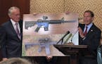 Sen. Edward Markey, D-Mass., left, and Sen. Richard Blumenthal, D-Ct., display a photo of a plastic gun on Tuesday, July 31, 2018, on Capitol Hill in 