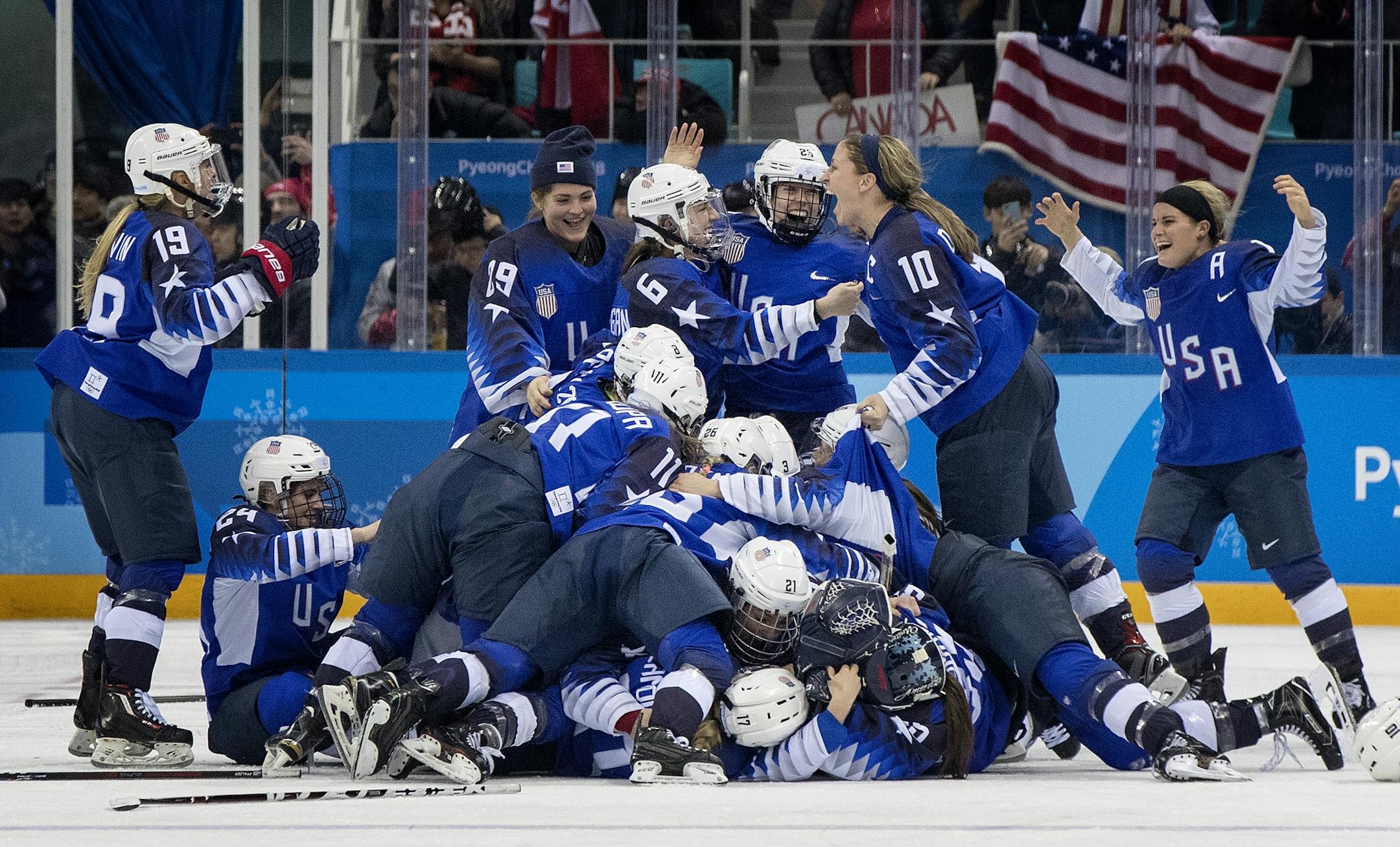 USA celebrated after beating Canada in a shootout to win the gold medal.