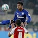 Schalke's Weston McKennie, 20, (top) challenged for the ball with Mainz's Abdou Diallo during a March 2018 Bundesliga match in Mainz, Germany. McKenni