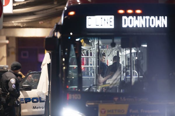 Minneapolis police investigated the scene on the Metro Transit bus where two people were shot Thursday night.