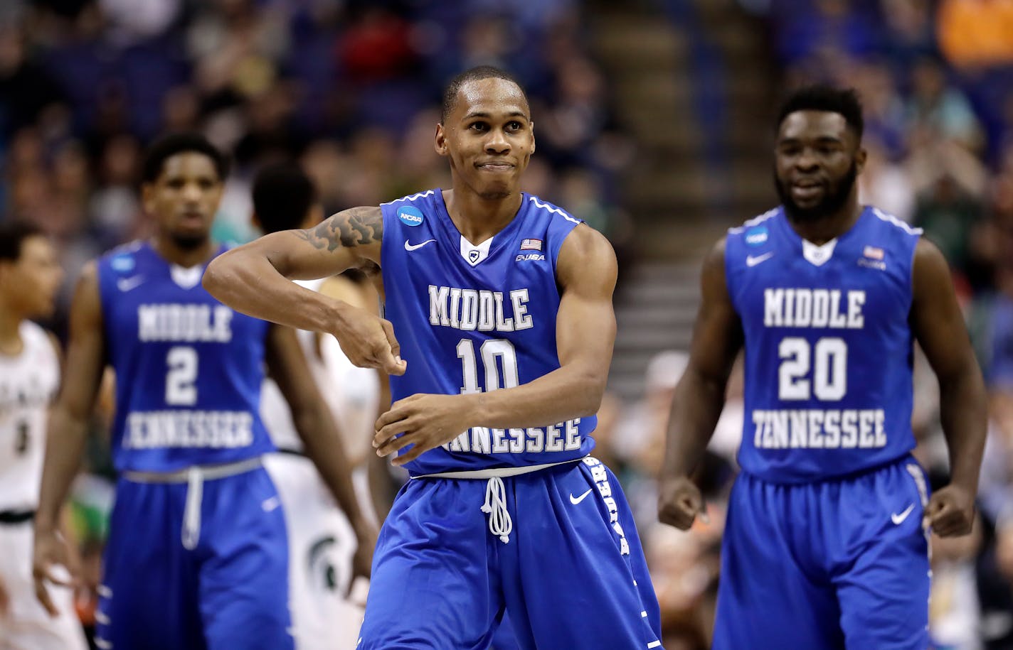 Middle Tennessee's Jaqawn Raymond (10) celebrates after making a basket during the first half of a first-round men's college basketball game against Michigan State in the NCAA Tournament, Friday, March 18, 2016, in St. Louis. (AP Photo/Charlie Riedel)