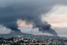 Smoke rises during protests in Noumea, New Caledonia, Wednesday May 15, 2024. France has imposed a state of emergency in the French Pacific territory 