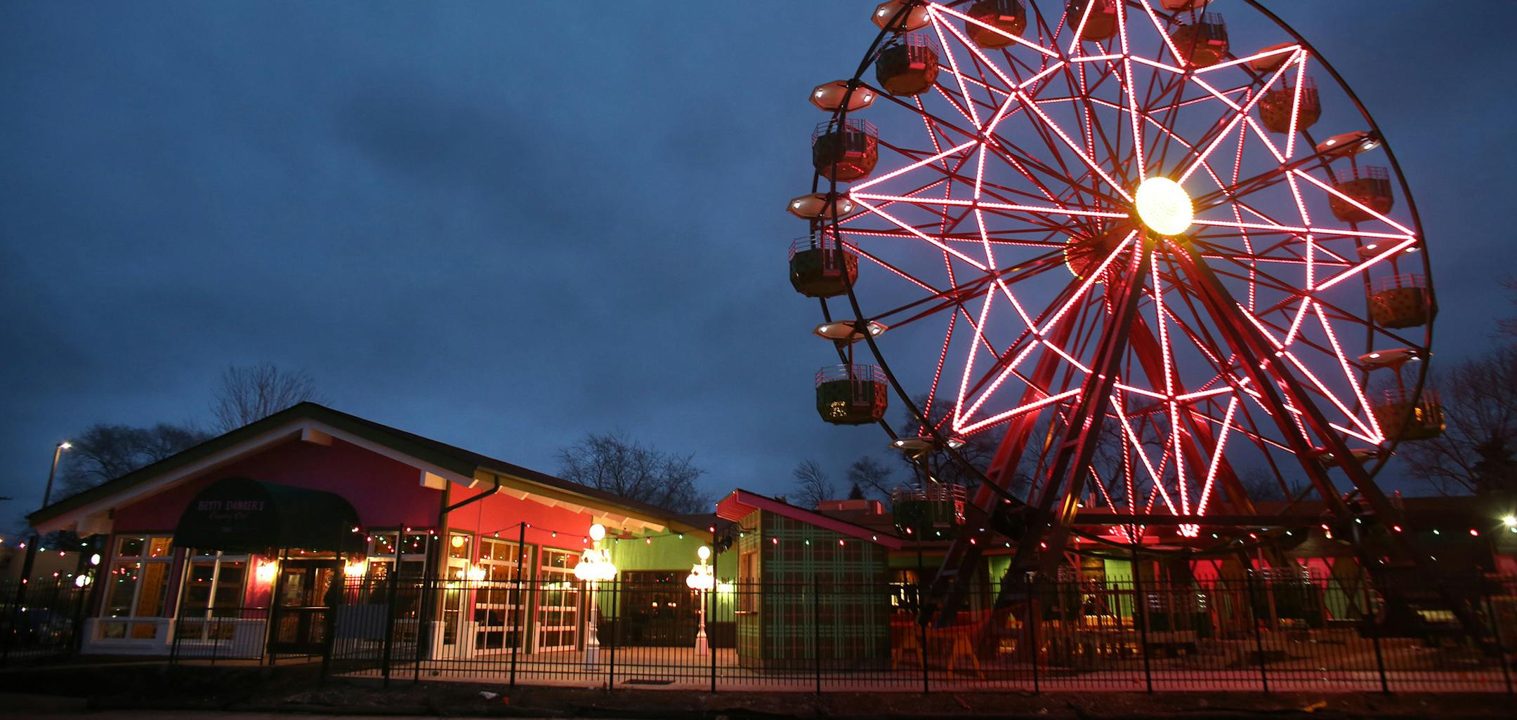 Betty Danger Country Club finally lit up their ferris wheel that will be running this spring. Patrons will be able to have dinner or just drinks while on it. ] (KYNDELL HARKNESS/STAR TRIBUNE) kyndell.harkness@startribune.com At the opening of Betty Danger Country Club in Minneapolis Min., Friday, December 26, 2014.