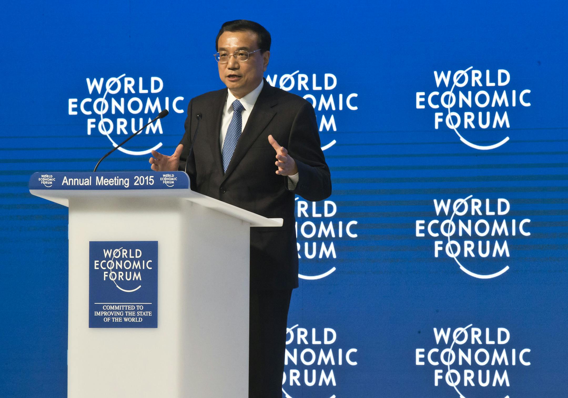 Chinese Premier Li Keqiang gestures as he speaks during the panel "The Global Impact of China's Economic Transformation" in Davos, Switzerland, Wednesday, Jan. 21, 2015. The meeting runs Jan. 21 through 24 under the overarching theme "The New Global Context". (AP Photo/Michel Euler) ORG XMIT: MEU142