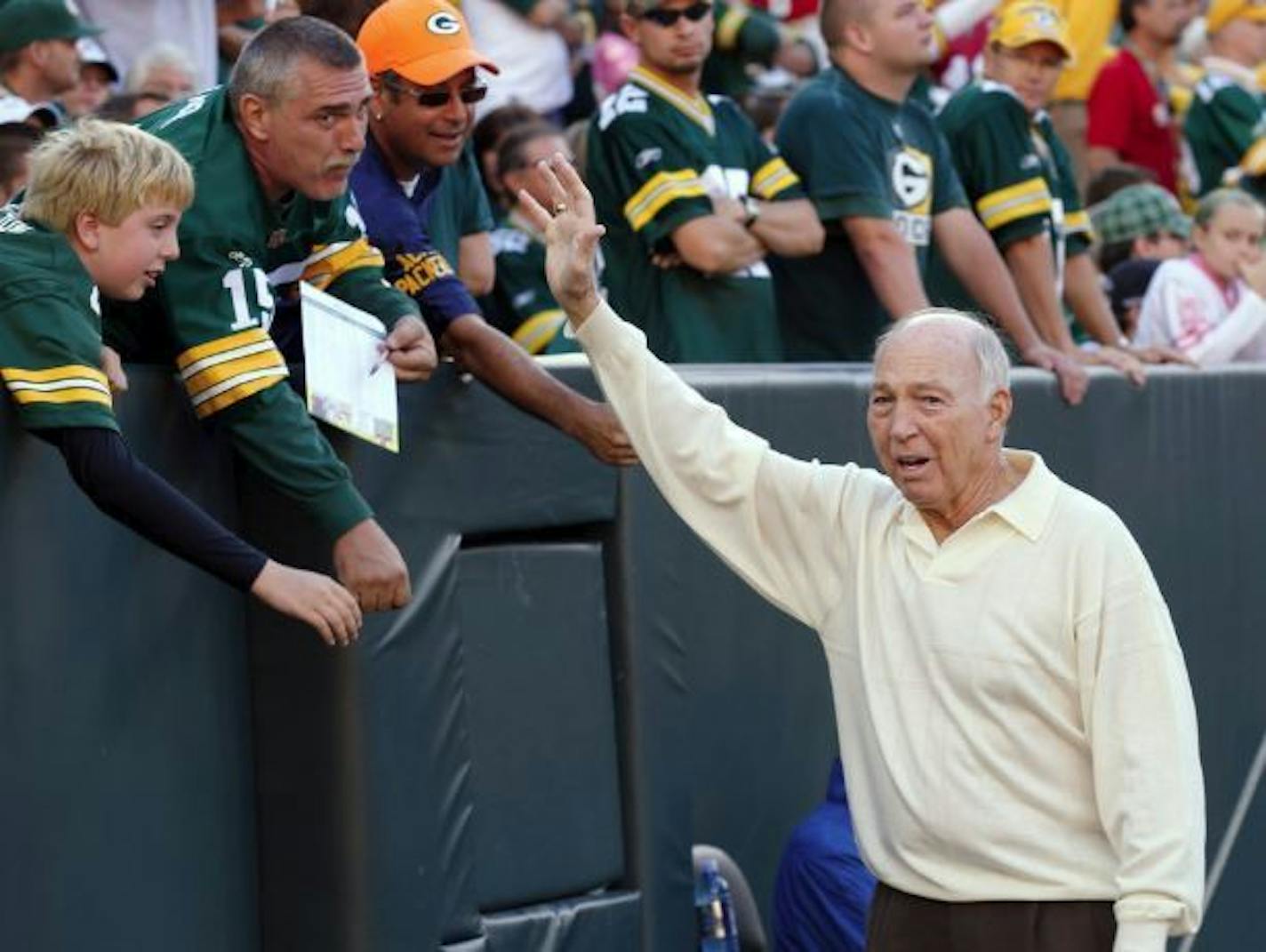 In this Sept. 10, 2012, file photo, former Green Bay Packers quarterback Bart Starr waves to fans during the Packers' NFL football game against the San Francisco 49ers in Green Bay, Wis. Bart Starr, the Green Bay Packers quarterback and catalyst of Vince Lombardi's powerhouse teams of the 1960s, has died. He was 85.