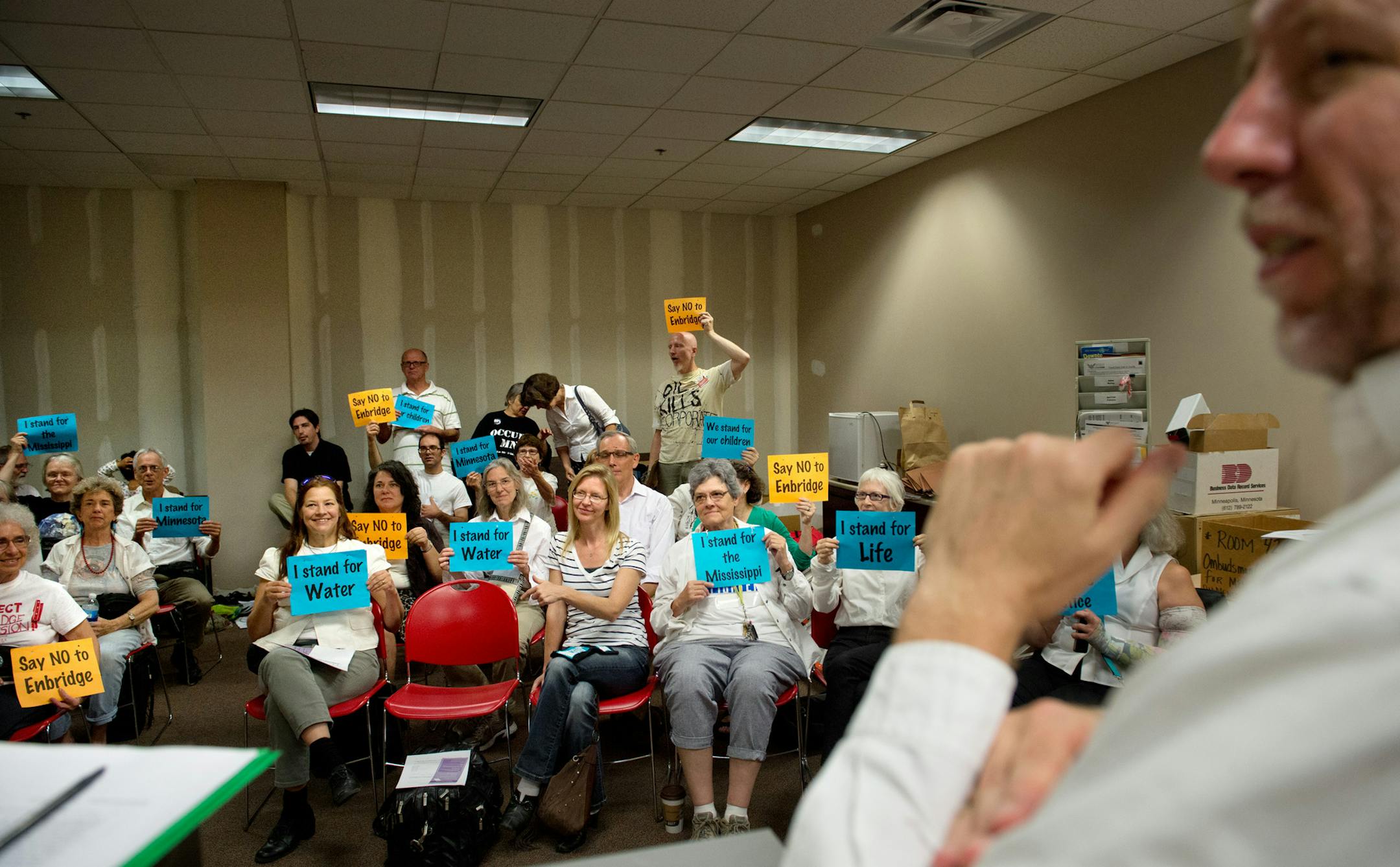 After the hearing, more than 40 anti-pipeline activists from MN350 met privately to talk about their next steps. The Minnesota Public Utilities Commission ruled to take a closer look at the pipeline expansion. On the right is MN350 coordinator Tom McSteen. Wednesday, September 4, 2013 ] GLEN STUBBE * gstubbe@startribune.com