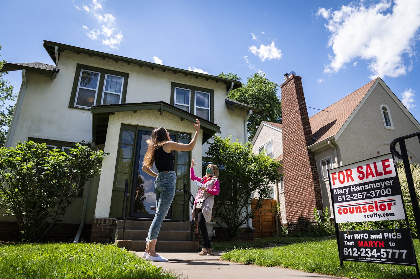 Kristin Hodnefield, left, jokingly expressed her frustration with the home-buying process with her Realtor, Emily Green, while looking at a home in south Minneapolis.