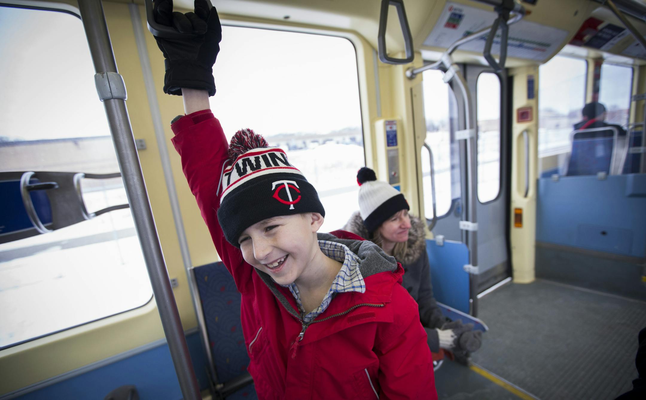 Karlis Barobs is a "trainiac." He rides the train every chance he gets, and is a devoted fan of the Choo Choo Bob train store and TV show. He is pictured while riding the Light Rail with his mother Jane Meyer on Monday, February 8, 2016 in Minneapolis, Minn. ] RENEE JONES SCHNEIDER • reneejones@startribune.com