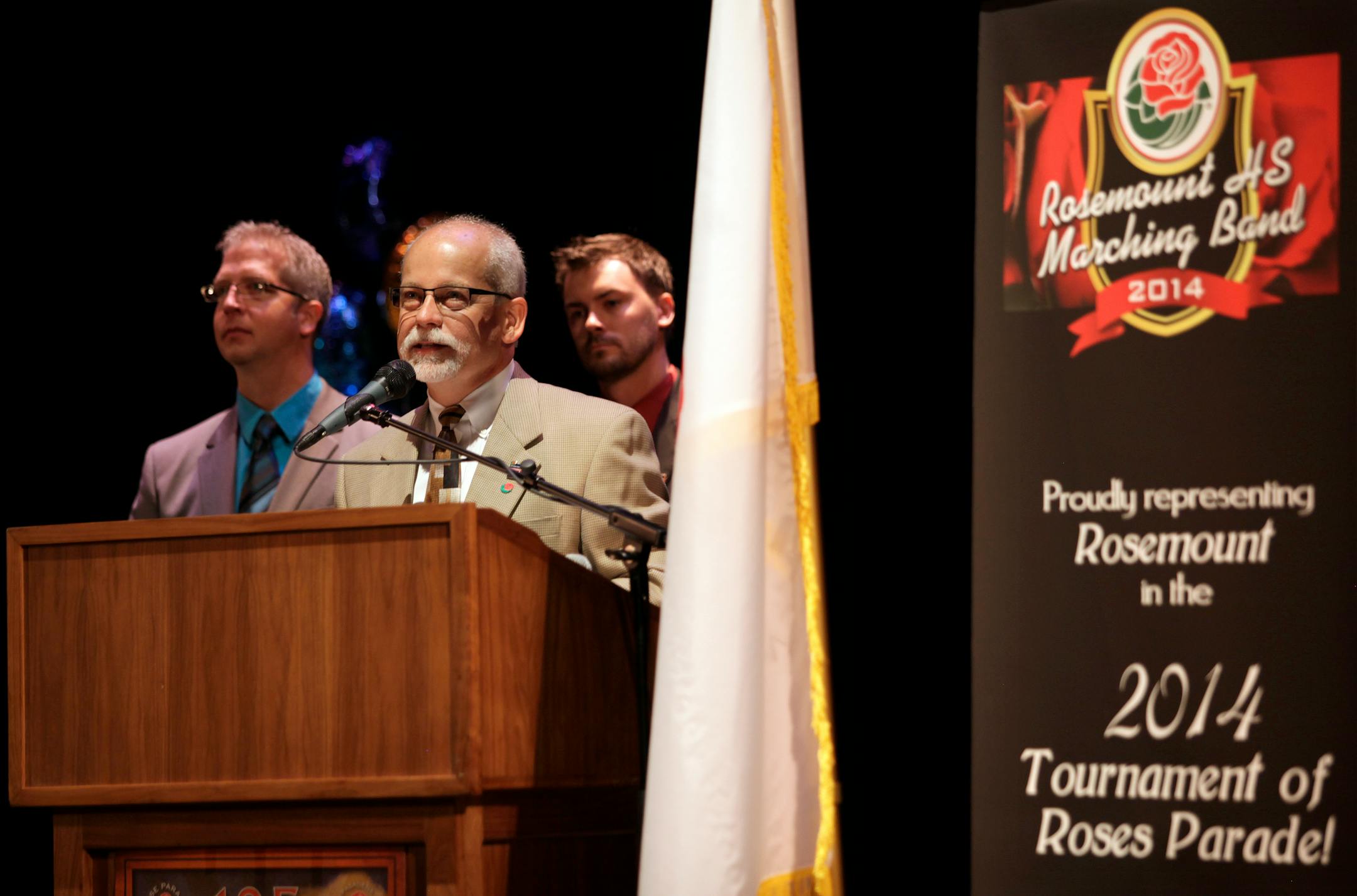 Band Directors (left to right) Leon Sieve, Steve Olsen (speaking) and Bo Hoover spoke at Pep rally to celebrate the President of the Tournament of Roses' visit to MN and Rosemount on July12, 2013.