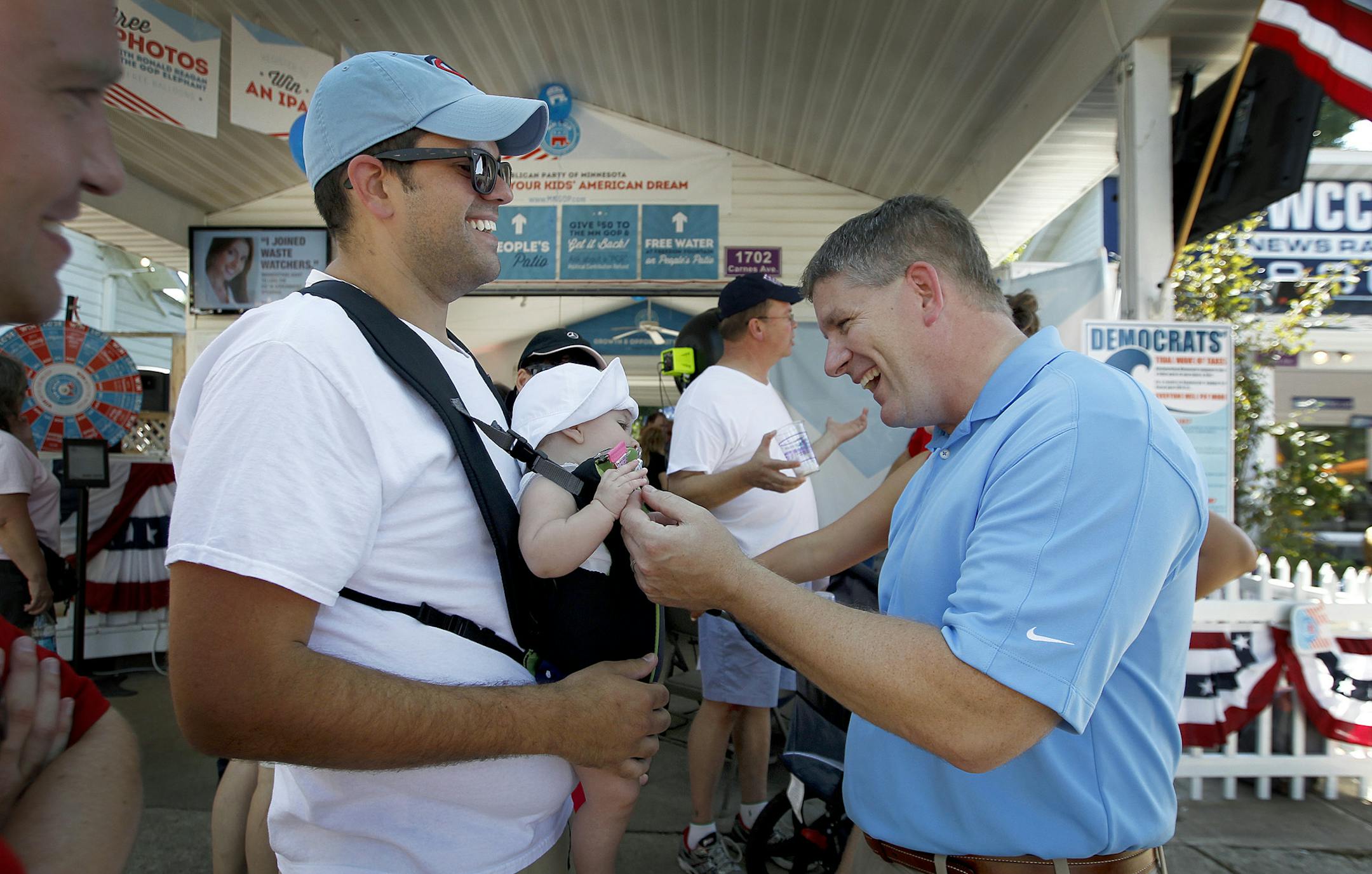 Kurt Zellers took some time to greet supporters including Luke Hellier of Edina and his daughter Betty in the Republican Headquarters at the Minnesota State Fair, Friday, August 23, 2013 in Falcon Heights, MN> (ELIZABETH FLORES/STAR TRIBUNE) ELIZABETH FLORES • eflores@startribune.com