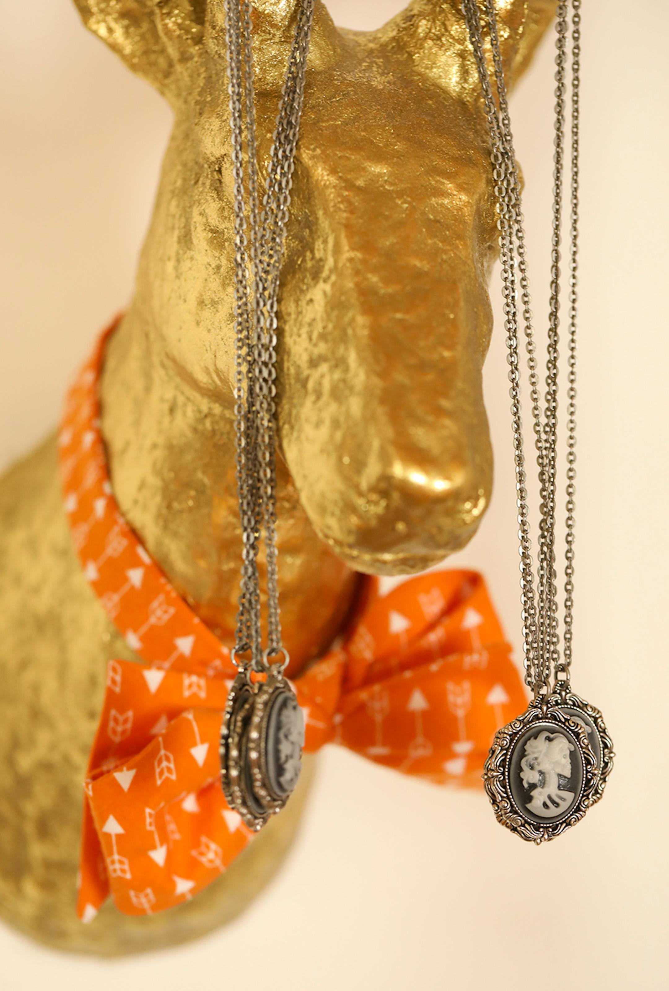 Steampunk-esque cameo necklaces and a men's bowtie on display in Minneapolis designer Samantha Rei's studio.