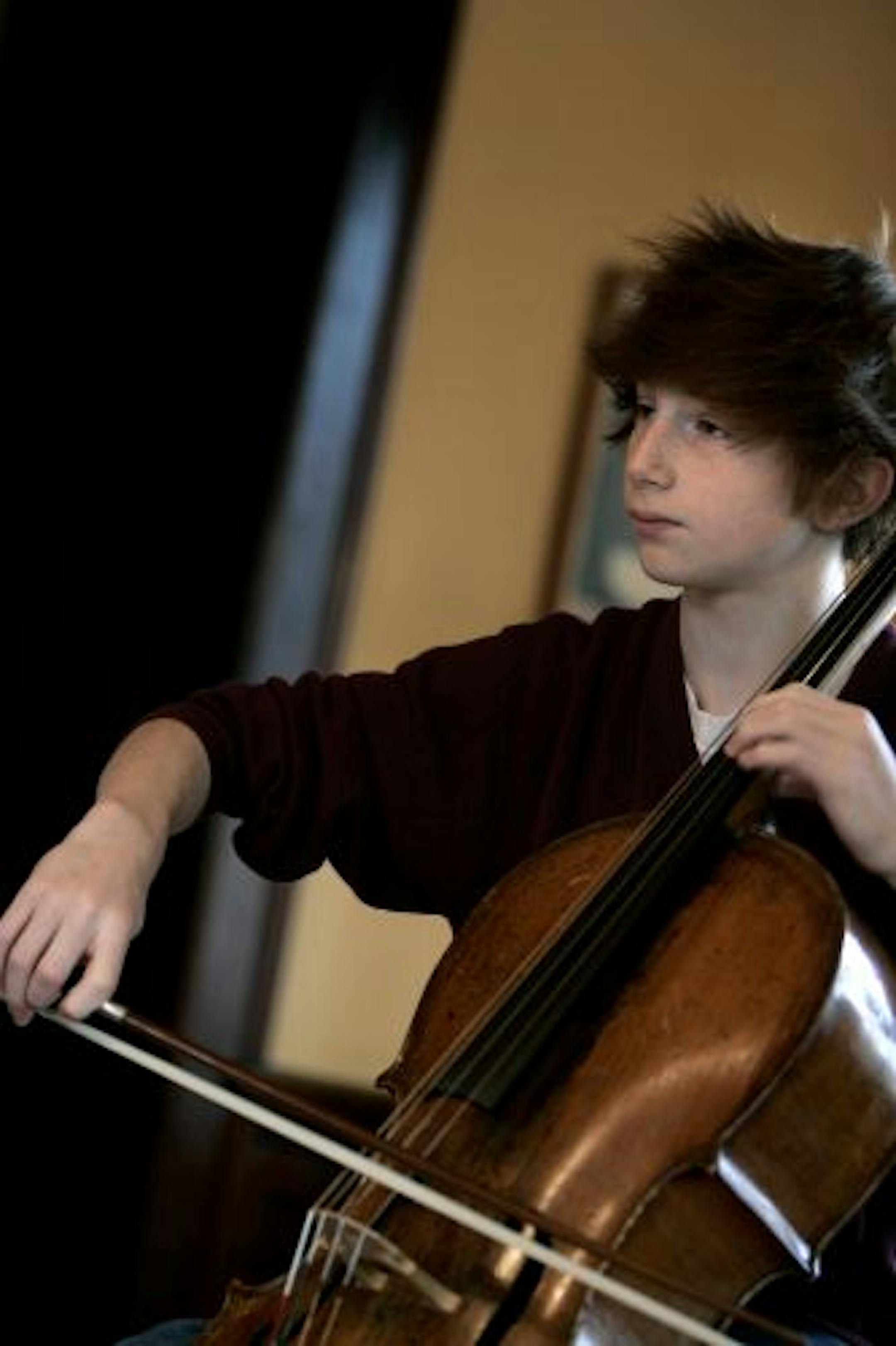 In 2007, then-13-year-old cellist Aaron Wolff practiced at home after winning the junior division of Minnesota Sinfonia's Young Artist Competition.