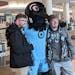 Supporters Logan Schweitzberger (right, from Brainerd) and Matt Garrett (left, from Columbia Heights) posed with Minnesota United mascot P.K. at MSP 