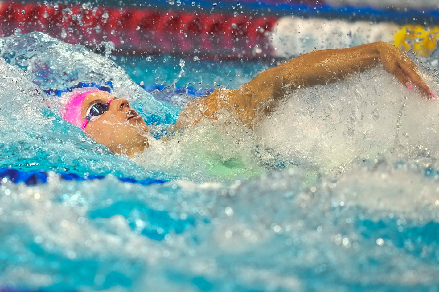 Regan Smith participates in the women's 100 backstroke during wave 2 of the U.S. Olympic Swim Trials on Tuesday, June 15, 2021, in Omaha, Neb. (AP Photo/Charlie Neibergall)