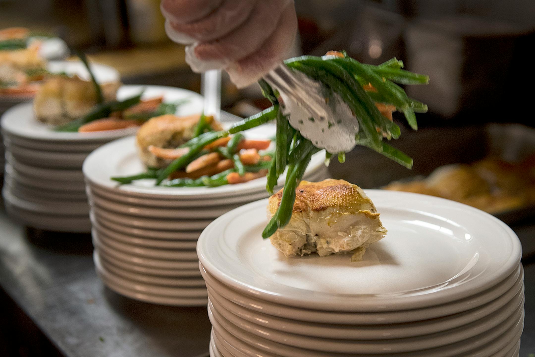 Dishes were plated in the kitchen during a Friday night at Chanhassen Dinner Theatres.
