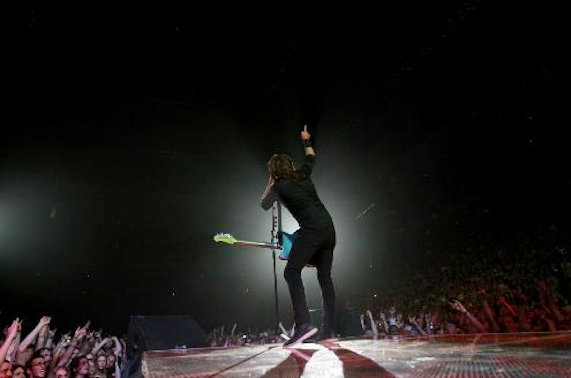 Dave Grohl worked the Foo Fighters crowd for two-plus hours -- and then threw in two covers. / Photos by Carlos Gonzalez, Star Tribune