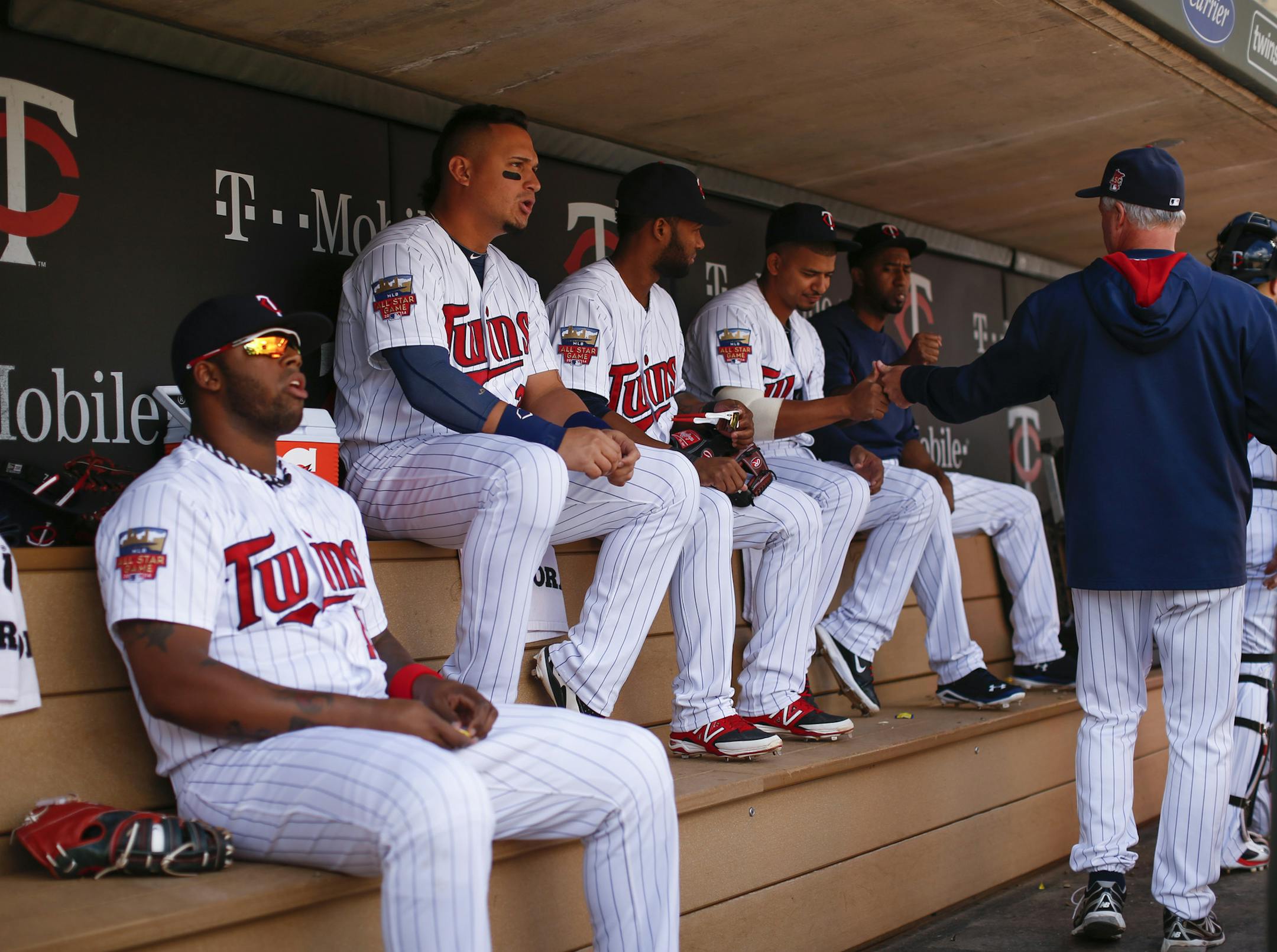 The Twins&#x2019; dugout is filling up with more and more Latin players such as (from left) first baseman/designated hitter Kennys Vargas, right fielder Oswaldo Arcia, shortstop Danny Santana and infielder Eduardo Escobar. Yet the team only has bullpen coach Bobby Cuellar and former star Tony Oliva on staff who can fluently converse with them in Spanish.