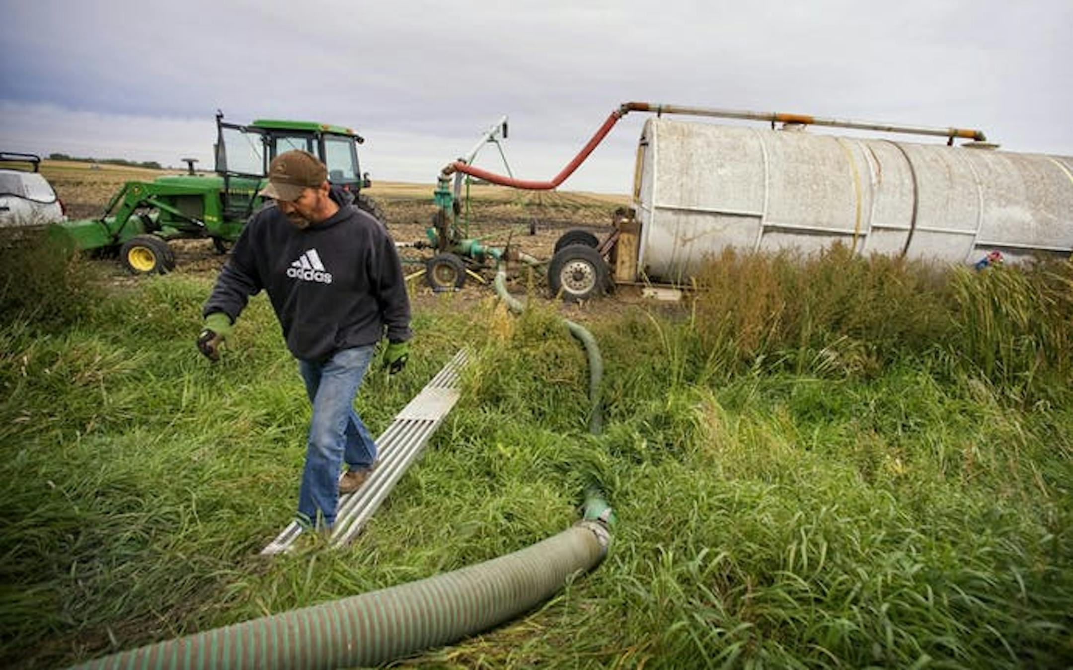 Rick Serbus spread hog manure of farm fields near Redwood Falls, Minn. The recent cold front wafted southern Minnesota farm odors to Kansas City, Mo.