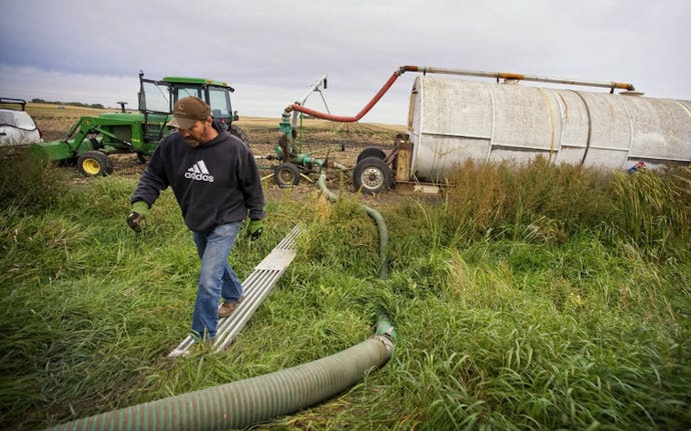 Rick Serbus spread hog manure of farm fields near Redwood Falls, Minn. The recent cold front wafted southern Minnesota farm odors to Kansas City, Mo.