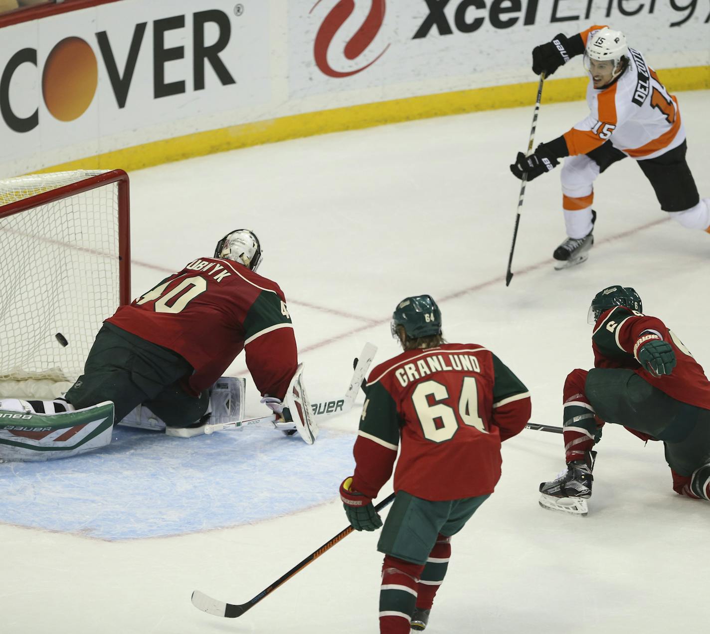 Philadelphia Flyers defenseman Michael Del Zotto (15) slipped the puck between Wild goalie Devan Dubnyk and the pipe for the game winning goal in the overtime period Thursday night. ] JEFF WHEELER &#xef; jeff.wheeler@startribune.com The Minnesota Wild lost 4-3 in overtime to the Philadelphia Flyers in an NHL hockey game Thursday night, January 7, 2016 at Xcel Energy Center in St. Paul.