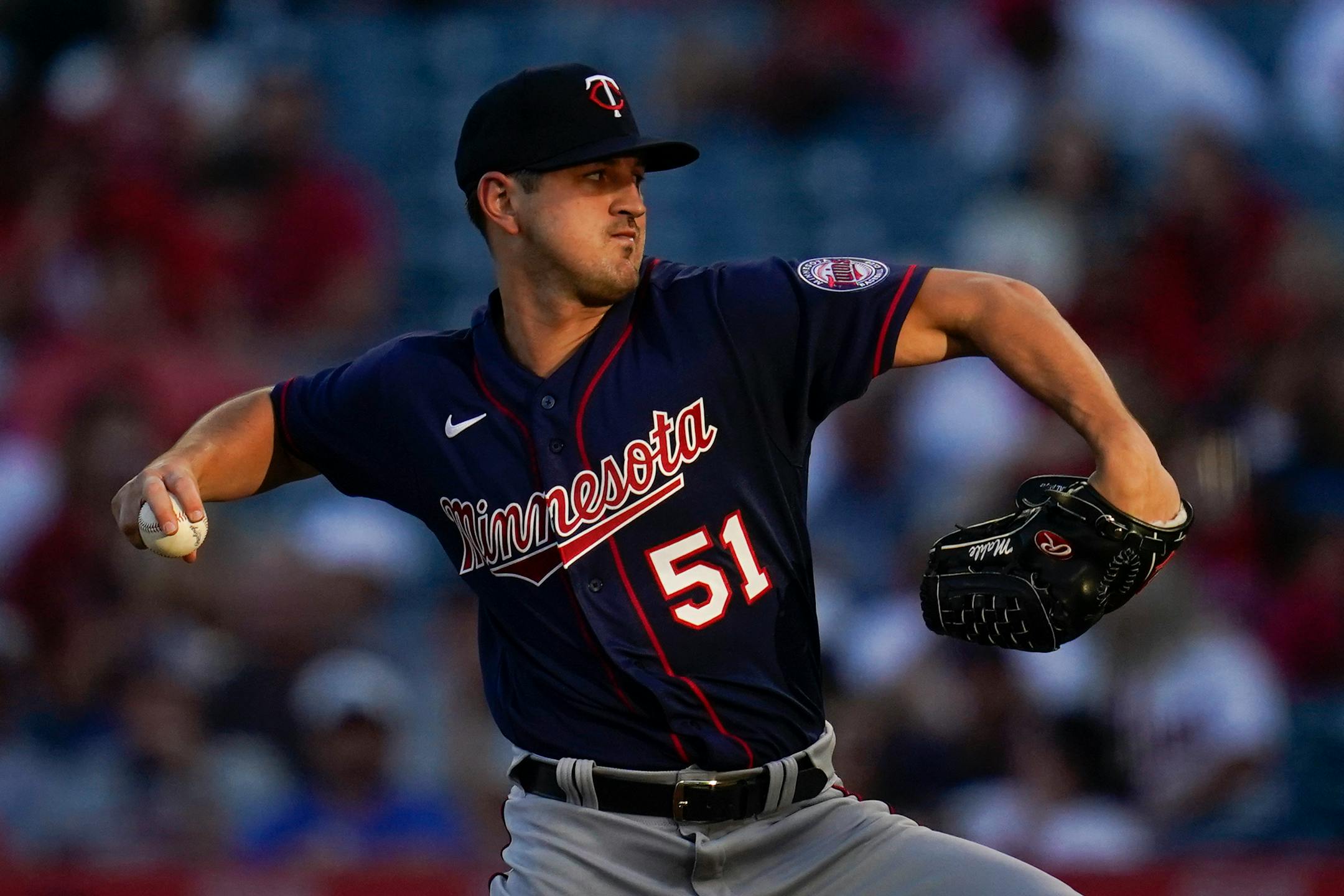 Minnesota Twins starting pitcher Tyler Mahle (51) throws during the first inning of a baseball game against the Los Angeles Angels in Anaheim, Calif., Friday, Aug. 12, 2022. (AP Photo/Ashley Landis)