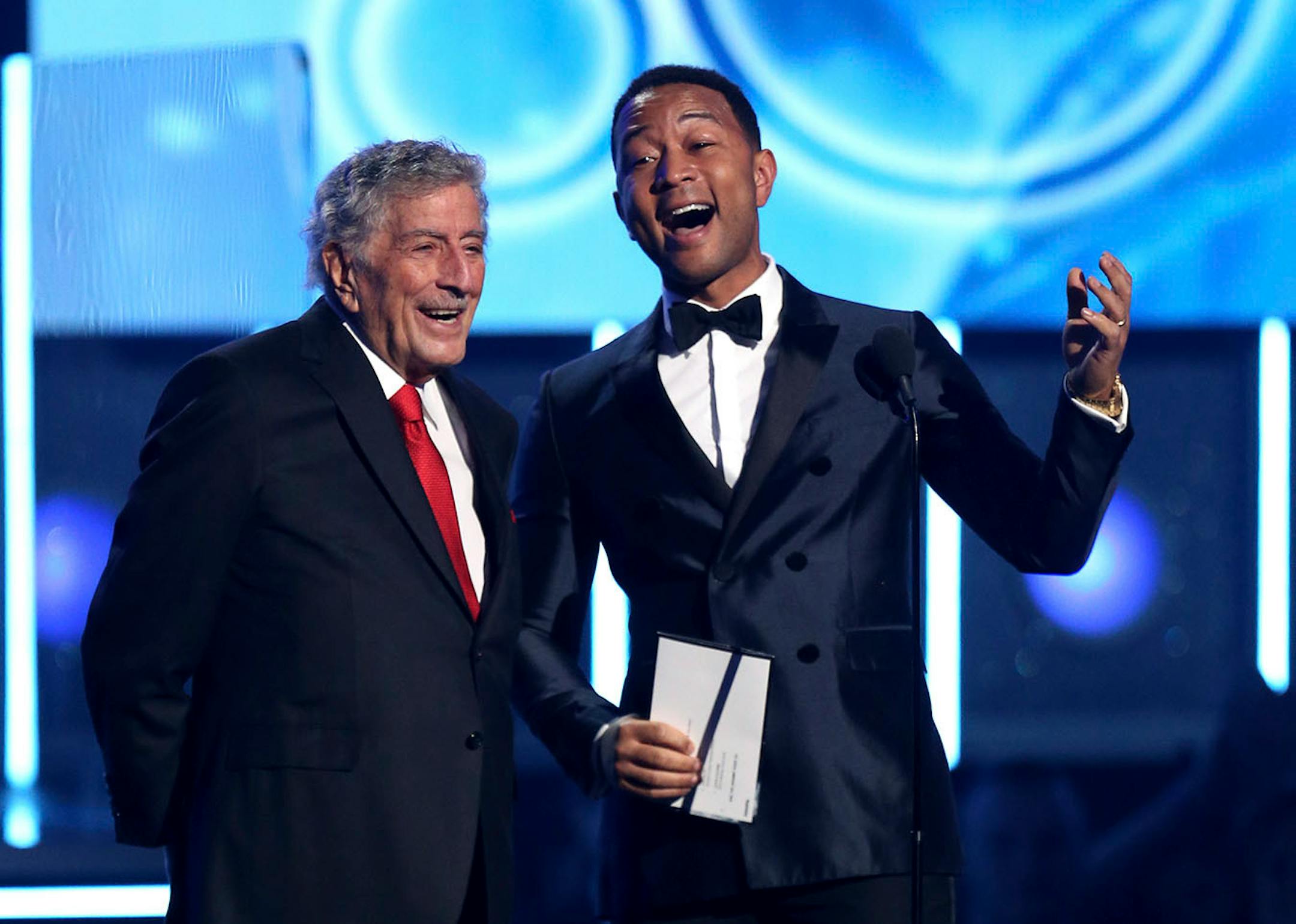 Tony Bennett, left, and John Legend present the award for best rap/sung performance at the 60th annual Grammy Awards at Madison Square Garden on Sunday, Jan. 28, 2018, in New York.