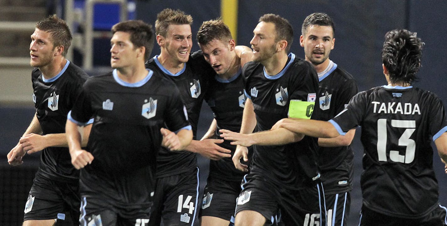 United players celebrated after they scored a winning goal late in the game.