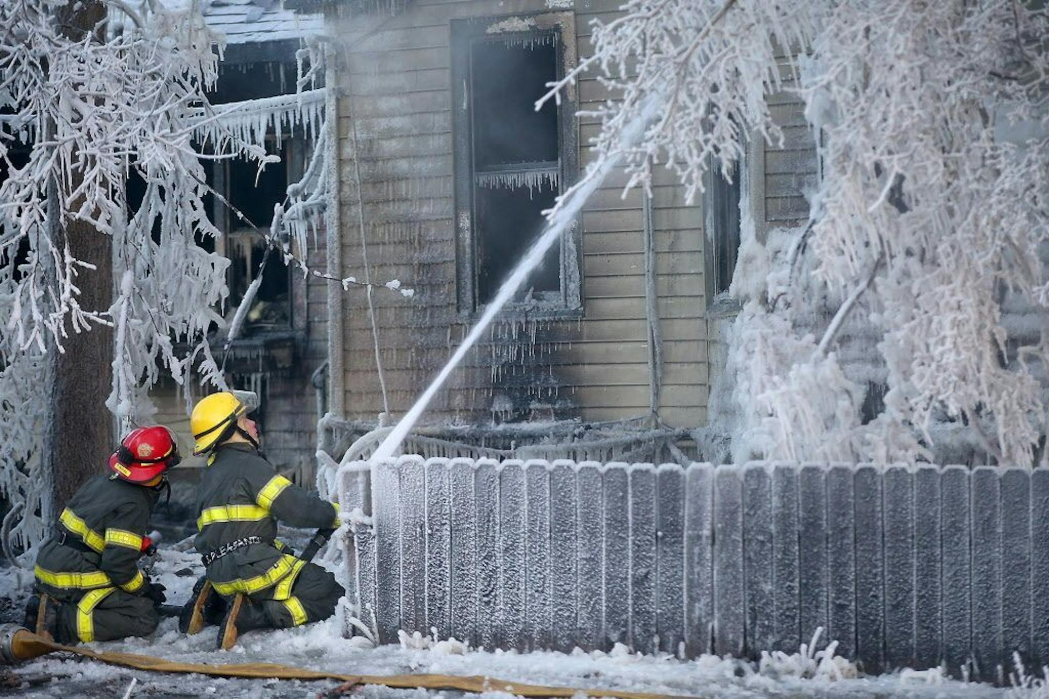 Minneapolis firefighters battled a house fire at the corner of E. 38th Street and Park Avenue South, Thursday, February 26, 2015 in Minneapolis, MN.