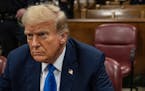 Former President Donald Trump sits in court on the first day of opening arguments in his trial at Manhattan Criminal Court in New York, Monday, April 