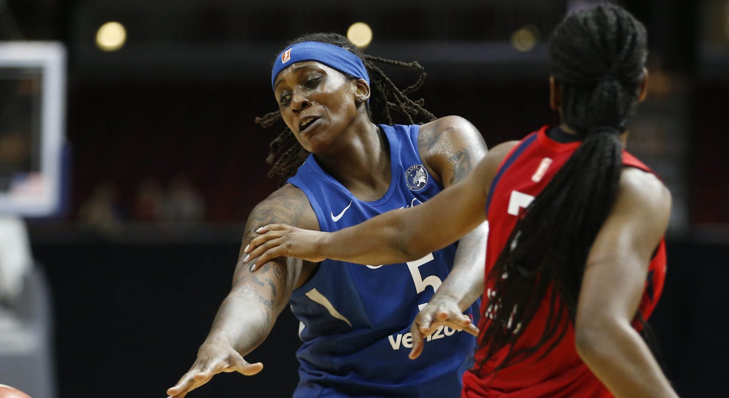 Lynx forward Lynetta Kizer (5) gets the ball knocked away by Mystics guard Ariel&#xa0;Atkins (7) Sunday, May 6, 2018, during their WNBA preseason game at Wells Fargo Arena in Des Moines, Iowa.