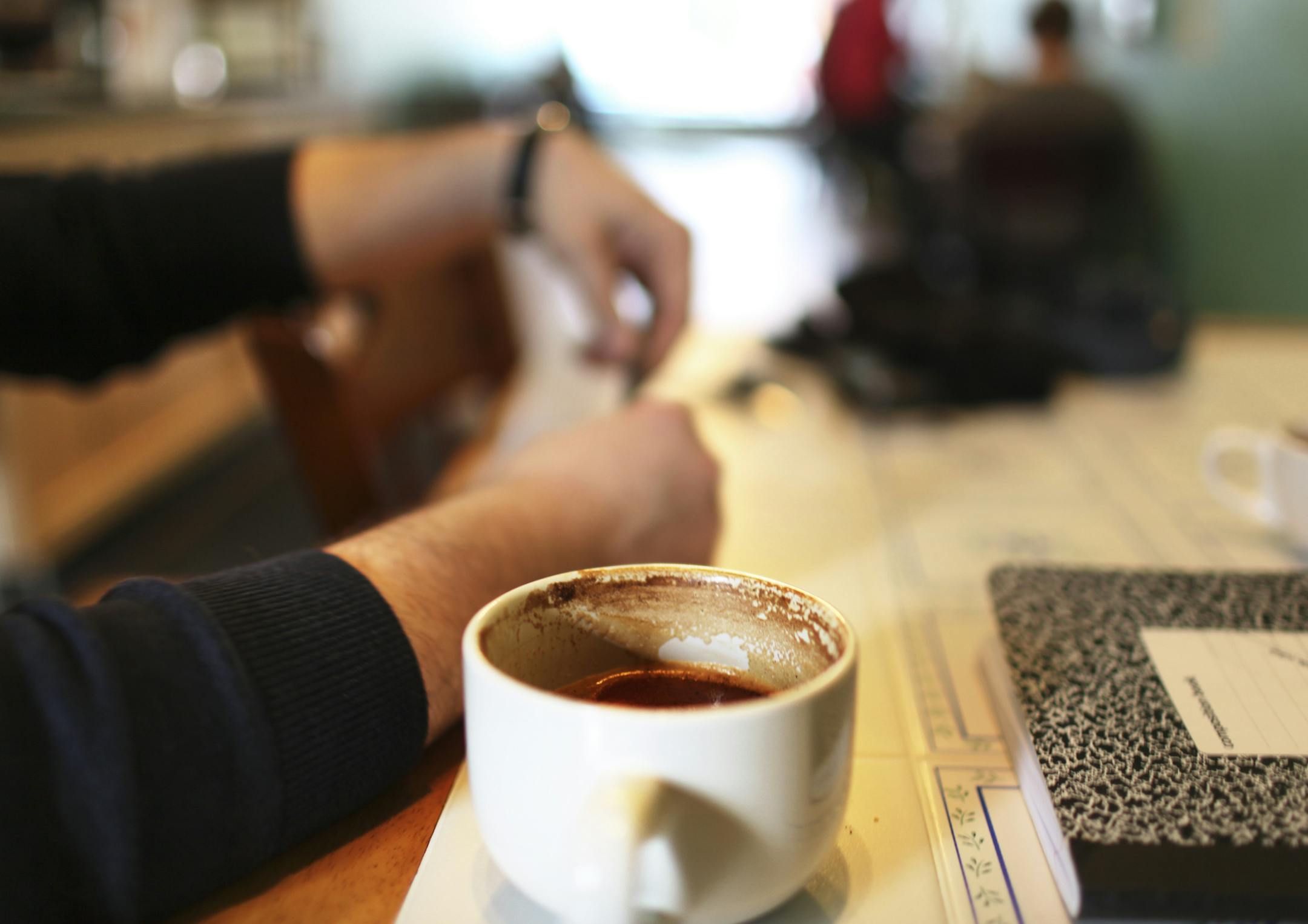 Cris Gibson, left, conversed over cappacinos and lattes with his friend and Justin James Friday, Jan. 18, 2013, at Groundswell coffee in St. Paul, MN. "I love the vibe here," said James, who does poetry at the coffee shop.] (DAVID JOLES/STARTRIBUNE) djoles@startribune.com Groundswell coffee, which has become a community anchor in its Midway neighborhood, is looking to expand with the help of its loyal customers. The shop just bought the adjacent yarn shop, plans to broaden its menu and wants to
