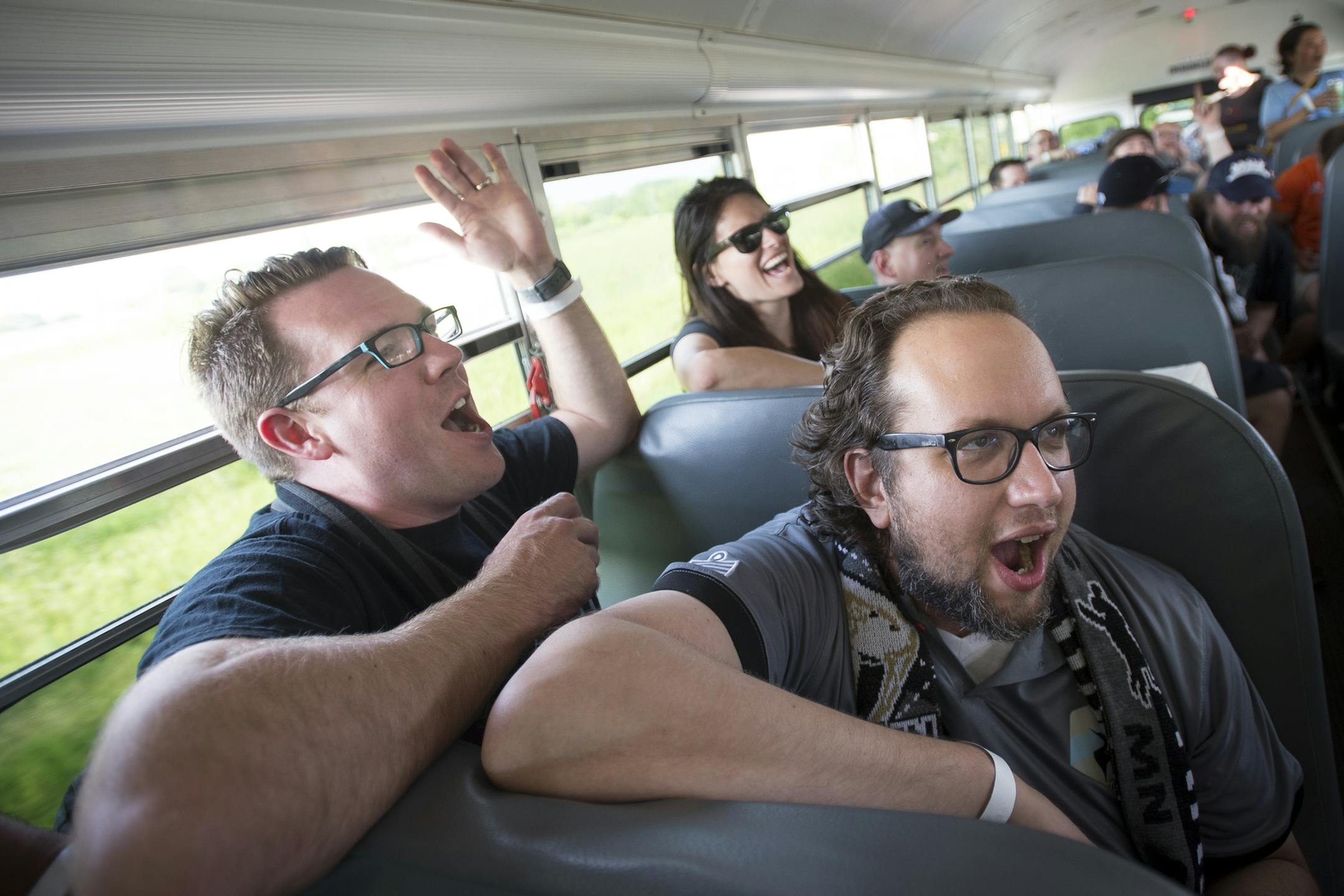 Dark Clouds Adam Jarvi, left, Eric Hedberg and Emily Peterson took part in a Minnesota United FC chant on a school bus on the way to Wednesday night's game against Jacksonville Armada at the National Sports Center in Blaine. ] Aaron Lavinsky &#x2022; aaron.lavinsky@startribune.com Feature on Dark Clouds fan group of Minnesota United soccer. They are a non-stop cheering bunch of soccer nuts who follow the team and support it with non-stop orchestrated cheering at games.