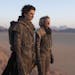 This image released by Warner Bros. Entertainment shows Timothee Chalamet, left, and Rebecca Ferguson in a scene from the upcoming 2021 film "Dune." W