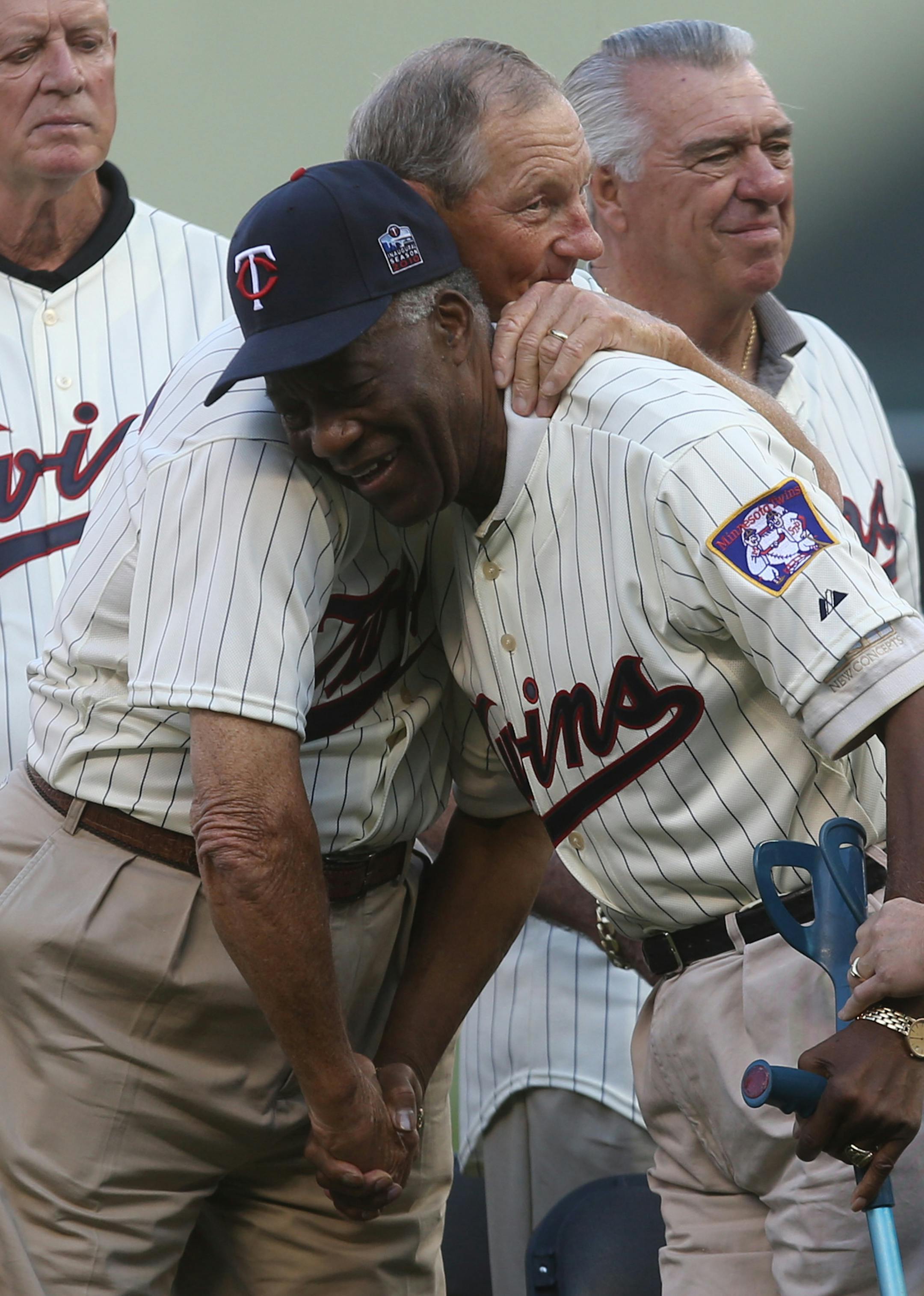 Former Twin Jim "Mudcat" Grant got a hug from his teammate Jim Kaat during a ceremony honoring the 1965 team. ] (KYNDELL HARKNESS/STAR TRIBUNE) kyndell.harkness@startribune.com Mariners vs Twins at Target Field in Minneapolis, Min., Saturday August 1, 2015.