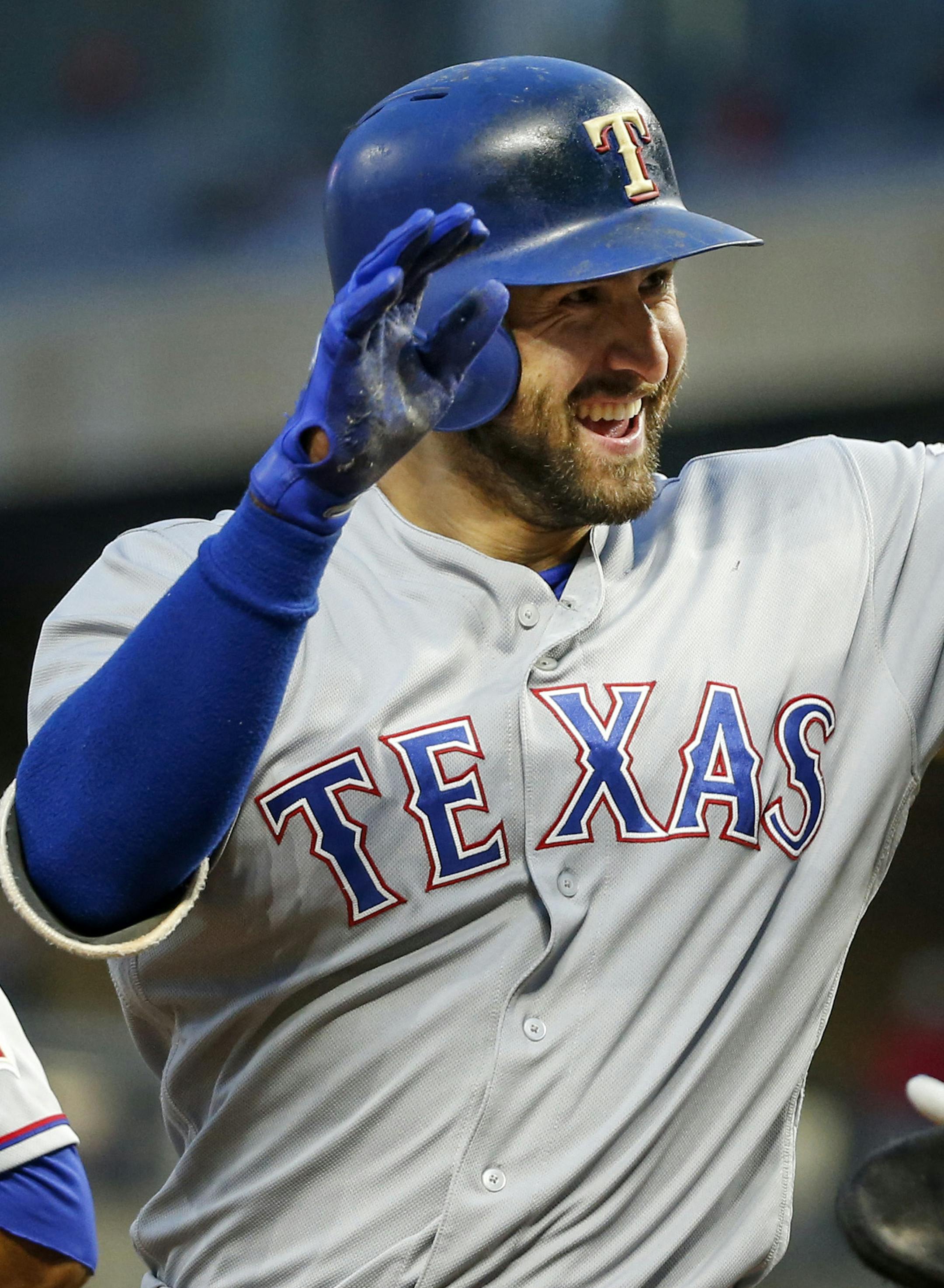 Texas Rangers third baseman Joey Gallo celebrates his three-run homer with Mike Napoli, right, and Carlos Gomez against the Minnesota Twins in the fourth inning of a baseball game Thursday, Aug. 3, 2017, in Minneapolis. (AP Photo/Bruce Kluckhohn)