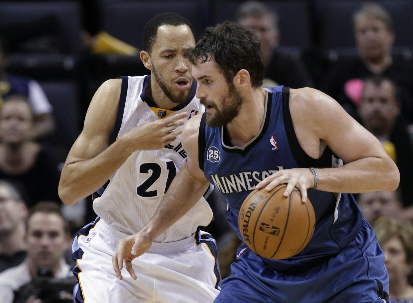 Tayshaun Prince (21), then with the Memphis Grizzlies, guarded the Wolves' Kevin Love in 2013. Prince, 35, agreed to a one-year deal that will reunite him with Wolves coach Flip Saunders.