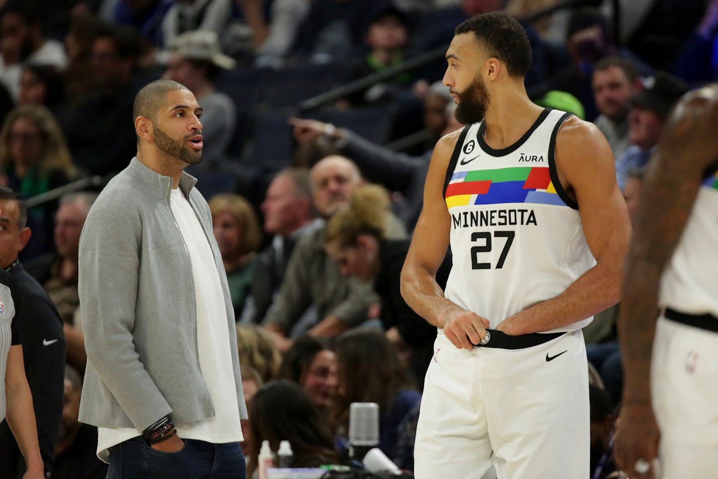 Los Angeles Clippers forward Nicolas Batum, left, talks with Minnesota Timberwolves center Rudy Gobert (27) during an NBA basketball game Friday, Jan. 6, 2023, in Minneapolis. (AP Photo/Andy Clayton-King)