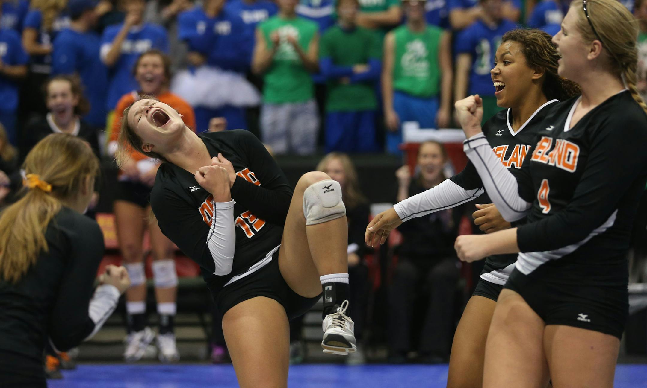 Delano's Tori Hanson celebrated with her team after scoring a point in the final game during the state championship Class 3A finals at the Xcel Energy Center in St. Paul, Min., Saturday, November 9, 2013. Eagan won over Delano 3-2. ] (KYNDELL HARKNESS/STAR TRIBUNE) kyndell.harkness@startribune.com ORG XMIT: MIN1311091956560117