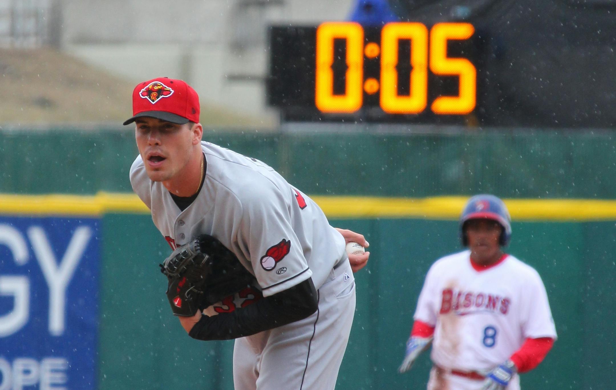 Rochester Red Wings pitcher Alex Meyer (32) looks in for a signal as a 20-second pitch clock is used for the Triple-A baseball opener between the Buffalo Bisons and Rochester Red Wings in Buffalo, N.Y., Thursday, April 9, 2015. (AP Photo/Bill Wippert) ORG XMIT: NYBW114 ORG XMIT: MIN1506251710371503