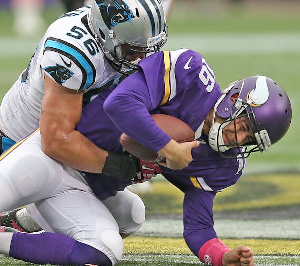 Minnesota Vikings quarterback Matt Cassel (16) was sacked by Carolina Panthers inside linebacker A.J. Klein (56) during the third quarter as the Vikin