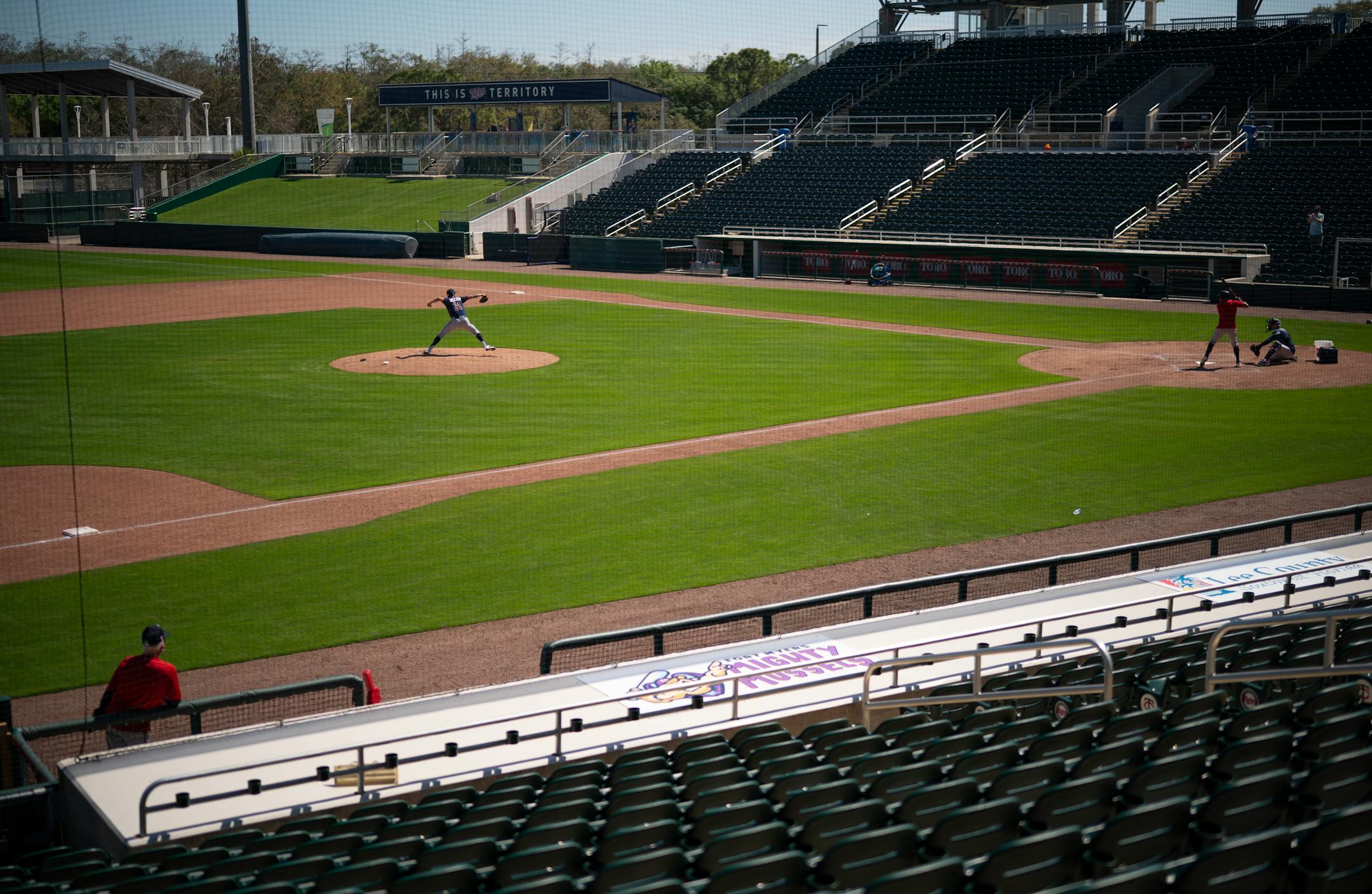 Minnesota Twins pitcher Devin Smeltzer threw a bit of batting practice after throwing in the bullpen during Tuesday's first full squad workout.