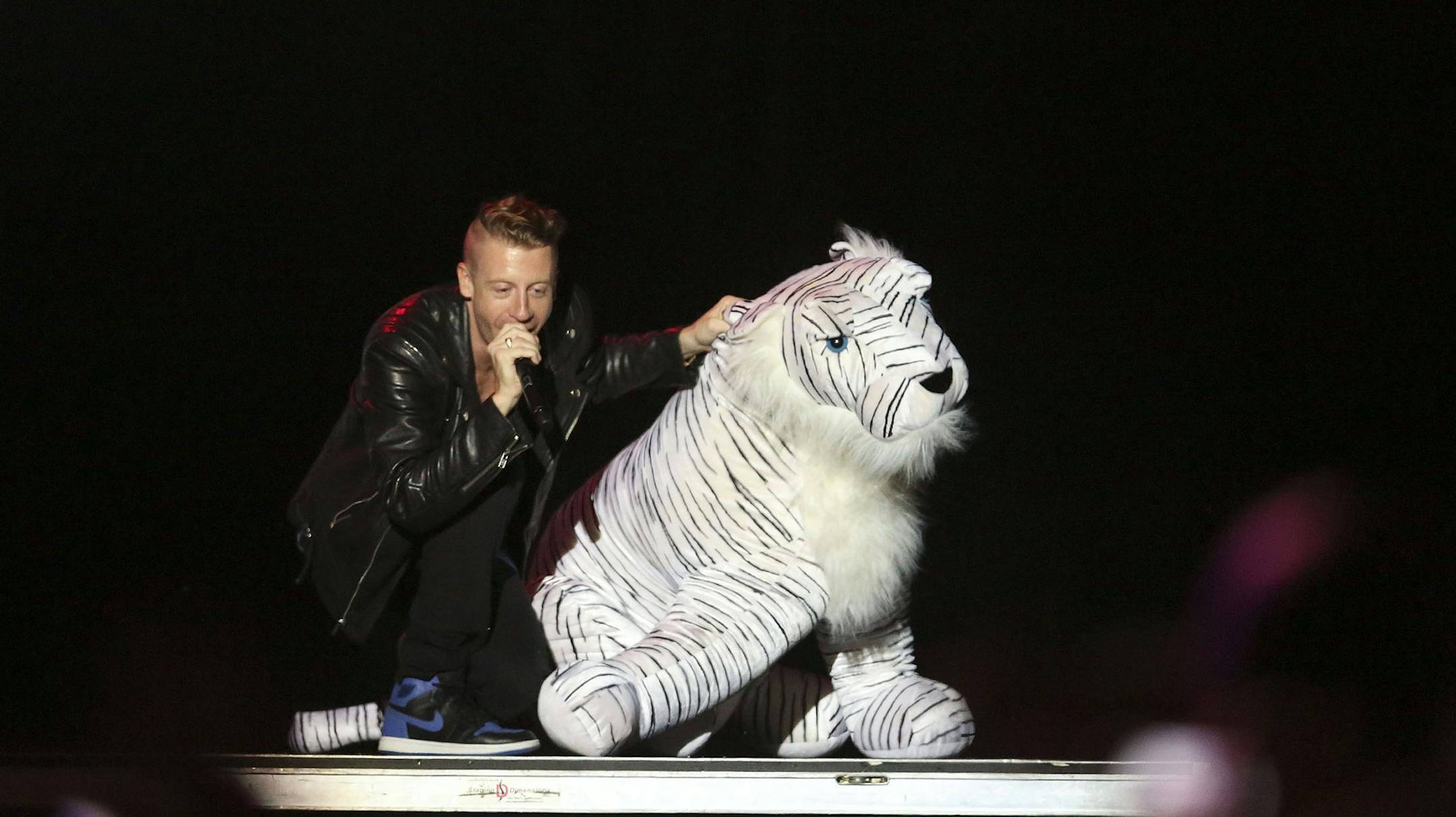 Macklemore danced with a stuff tiger as he and Ryan Lewis performed at the Minnesota State Fair Grandstand in Falcon Heights Min., Saturday, August 30, 2013. ] (KYNDELL HARKNESS/STAR TRIBUNE) kyndell.harkness@startribune.com