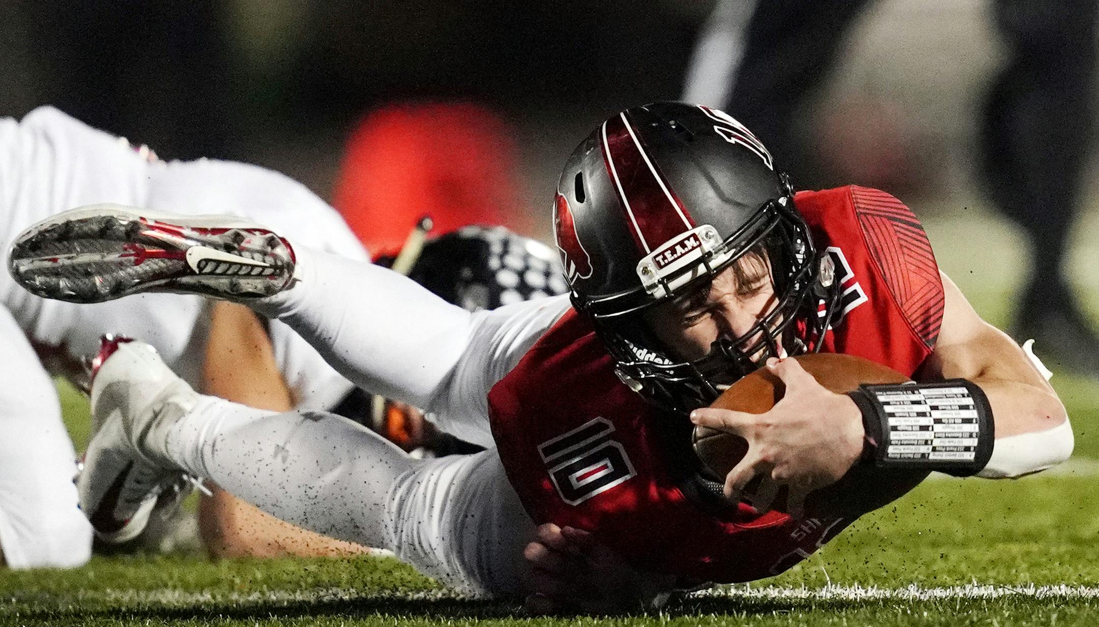 Shakopee quarterback David Bigaouette (10) dove to the ground as he tried to gain yards in the second half. ] ANTHONY SOUFFLE • anthony.souffle@startribune.com Shakopee played Farmington in a Class 6A football state tournament first round game Friday, Oct. 25, 2019 at Vaughan Field in Shakopee, Minn.