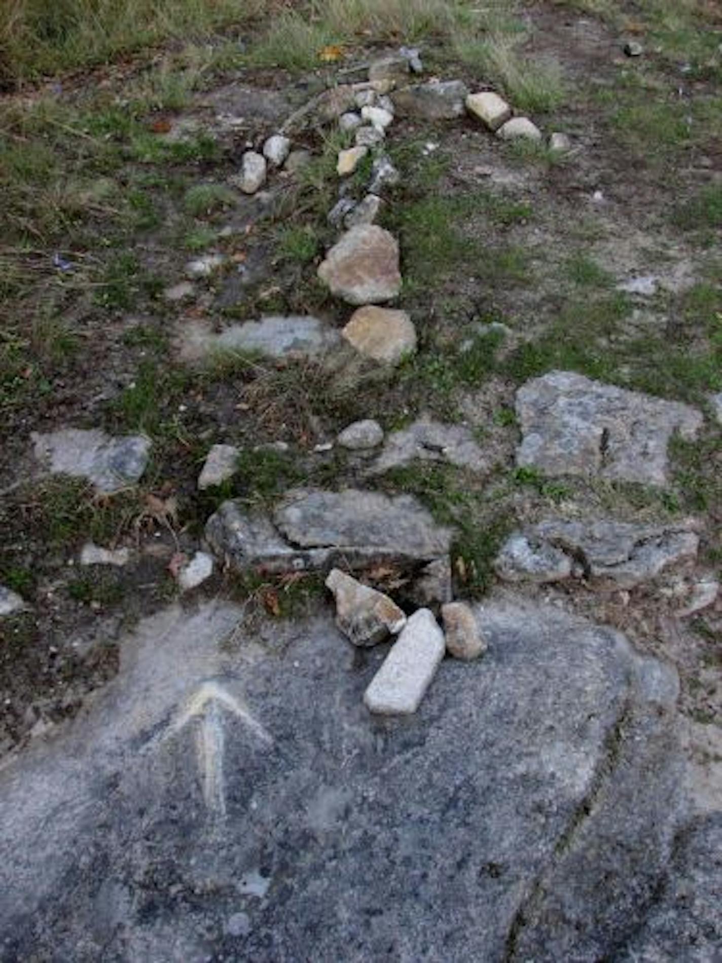 Some helpful souls scratched an arrow onto a stone, and created an arrow out of rocks to guide pilgrims when there were no markers.